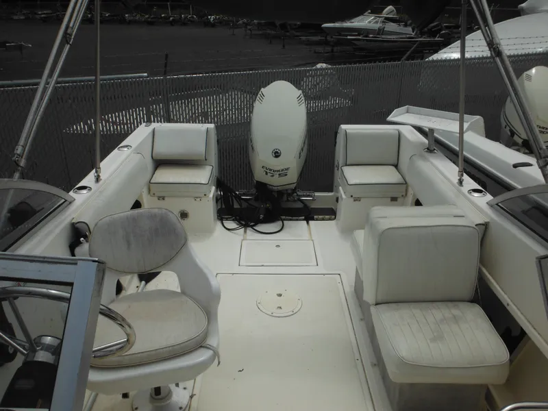 Slide: The Image of 1996 Hydra-Sports 2000 DC boat interior with seating and Evinrude outboard motor. - 25