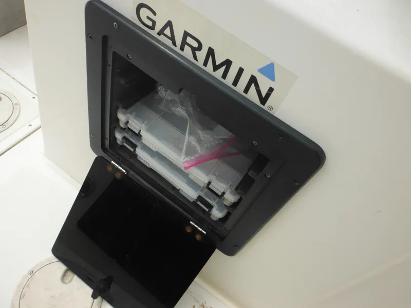 Slide: The Image of Garmin storage compartment on 1996 Hydra-Sports 2000 DC boat. - 26