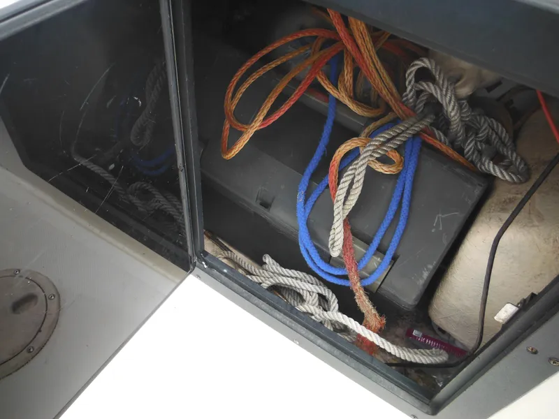 Slide: The Image of Storage compartment of 1996 Hydra-Sports 2000 DC boat with ropes and equipment. - 28