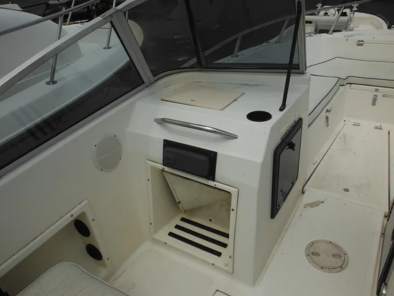Slide: The Image of 1996 Hydra-Sports 2000 DC boat interior with seating and storage compartments. - 29