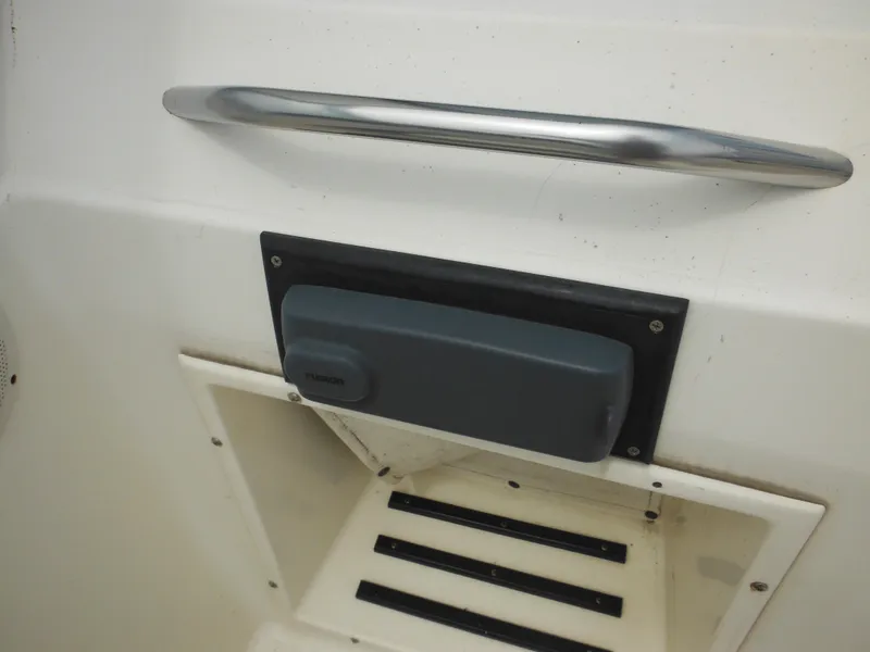 Slide: The Image of Hydra-Sports 2000 DC 1996 boat interior with handle and speaker. - 31