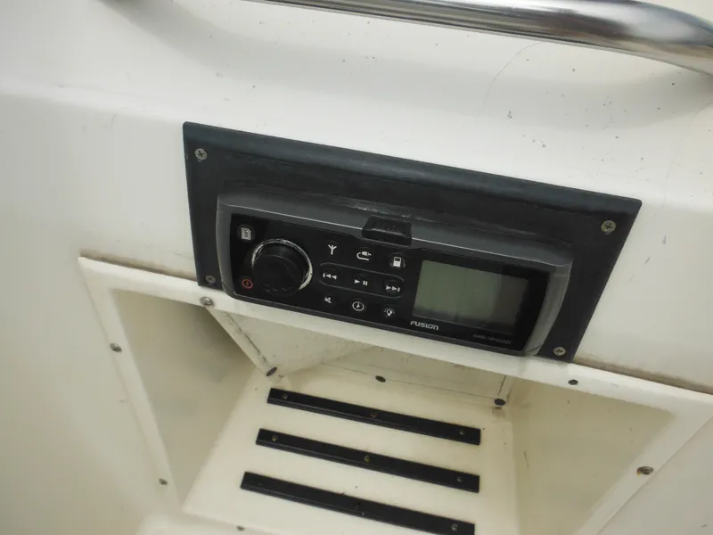 Slide: The Image of Fusion marine stereo on a 1996 Hydra-Sports 2000 DC boat dashboard. - 32