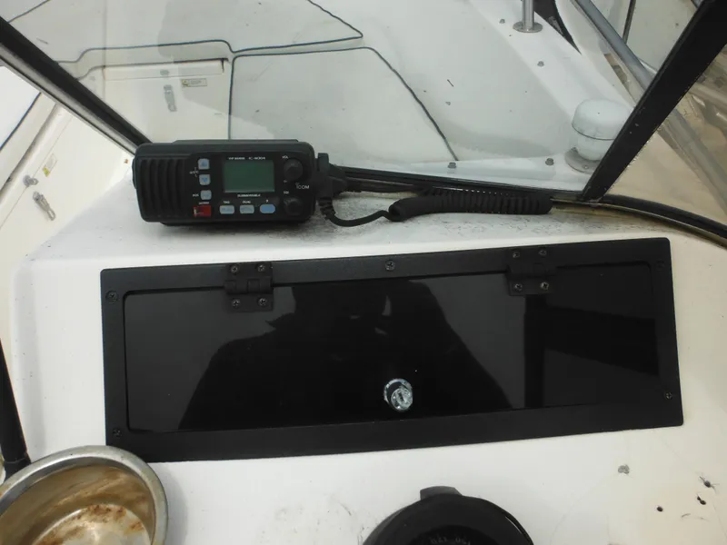 Slide: The Image of 1996 Hydra-Sports 2000 DC boat dashboard with radio equipment. - 34