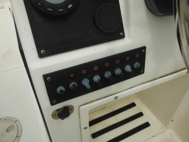 Slide: The Image of Control panel of a 1996 Hydra-Sports 2000 DC boat with switches and dials. - 36