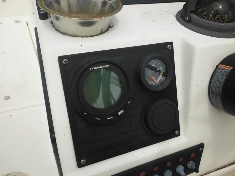 Slide: The Image of Control panel of a 1996 Hydra-Sports 2000 DC boat with gauges and switches. - 37