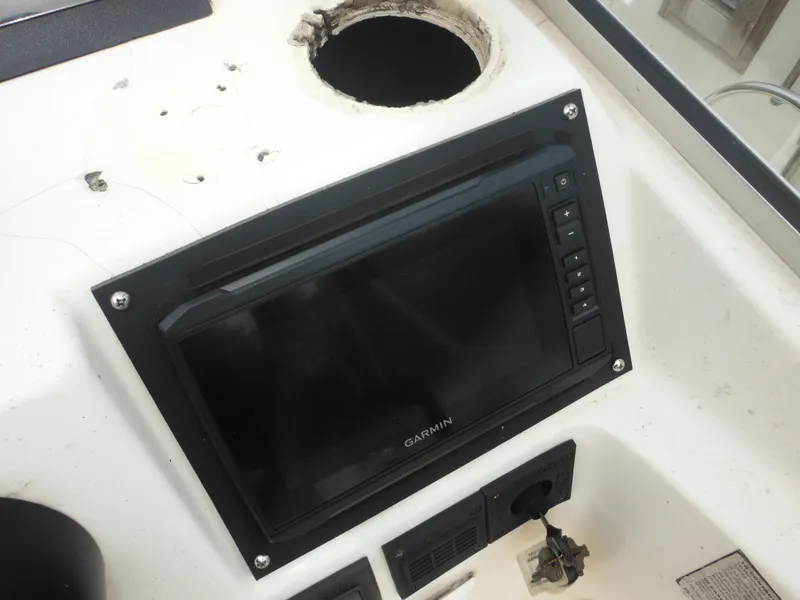 Slide: The Image of Garmin display on 1996 Hydra-Sports 2000 DC boat dashboard with empty gauge hole. - 39