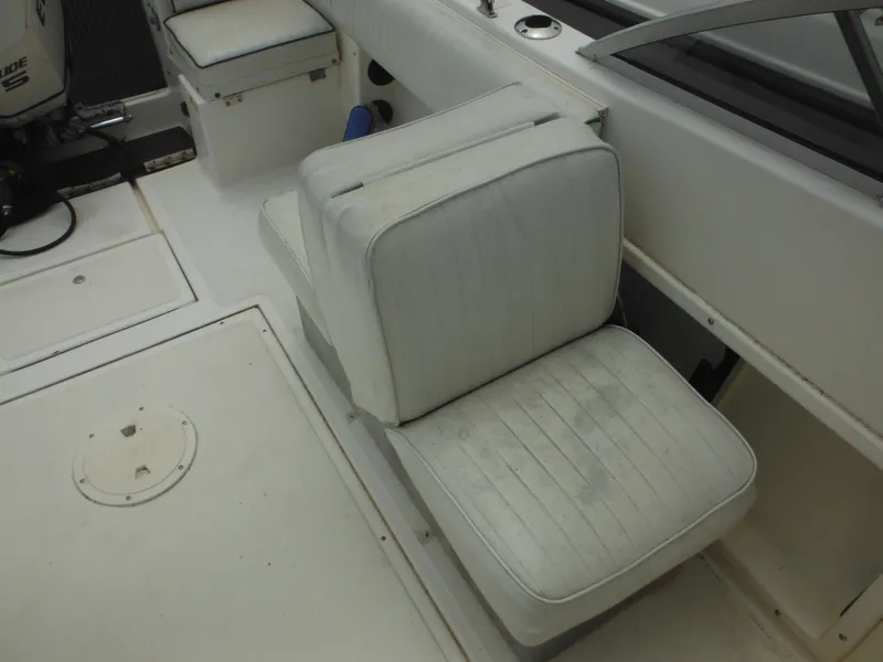 Slide: The Image of 1996 Hydra-Sports 2000 DC boat interior with white cushioned seating. - 42