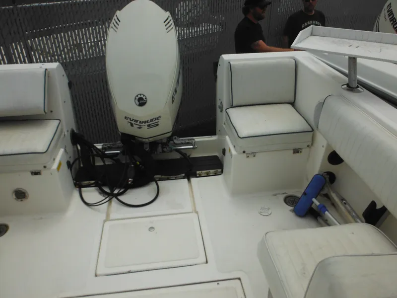Slide: The Image of 1996 Hydra-Sports 2000 DC boat interior with Evinrude 175 motor and white seating. - 43