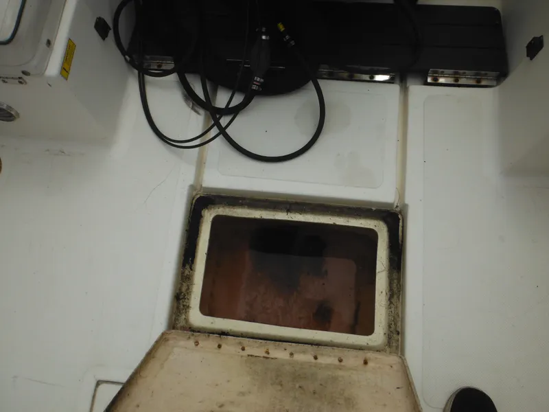 Slide: The Image of Open hatch on 1996 Hydra-Sports 2000 DC boat deck, showing interior compartment. - 48