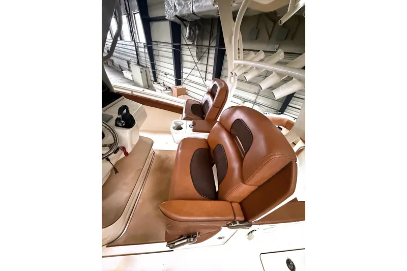 Slide: The Image of 2016 Scout 350 LXF boat interior with luxurious brown leather seating. - 17