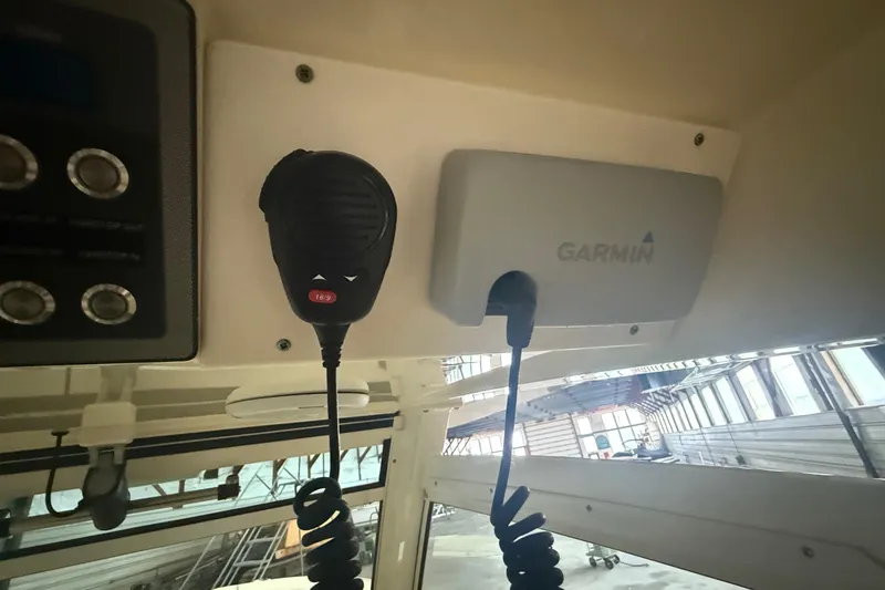 Slide: The Image of 2016 Scout 350 LXF boat interior with Garmin marine equipment and communication device. - 21