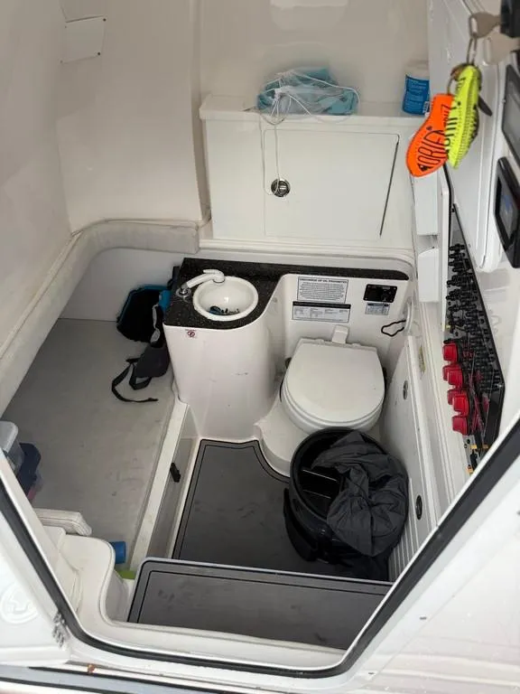 Slide: The Image of Interior of 2022 Sea Fox 328 Commander boat bathroom with sink and toilet. - 10