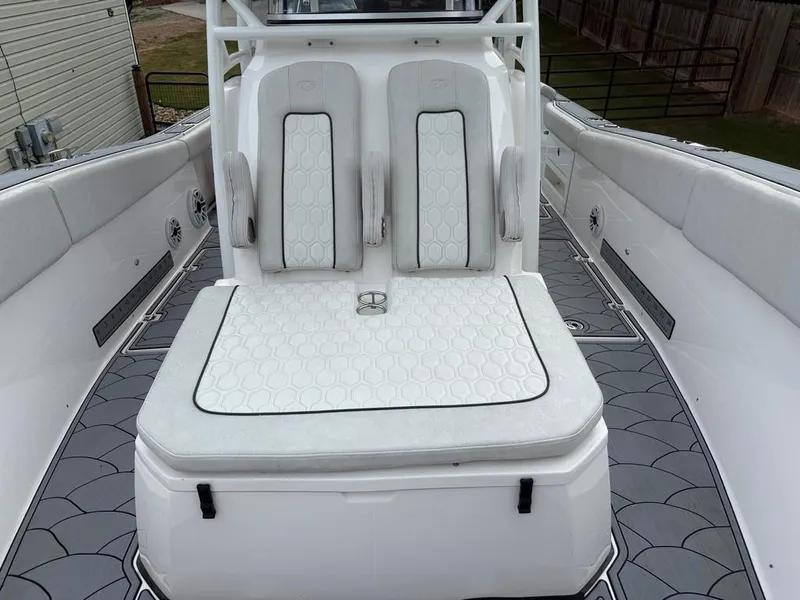Slide: The Image of 2022 Sea Fox 328 Commander boat interior with cushioned seating and modern design. - 12