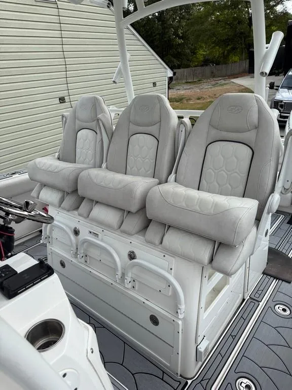 Slide: The Image of Luxury seating on 2022 Sea Fox 328 Commander boat, featuring three plush captain's chairs. - 13