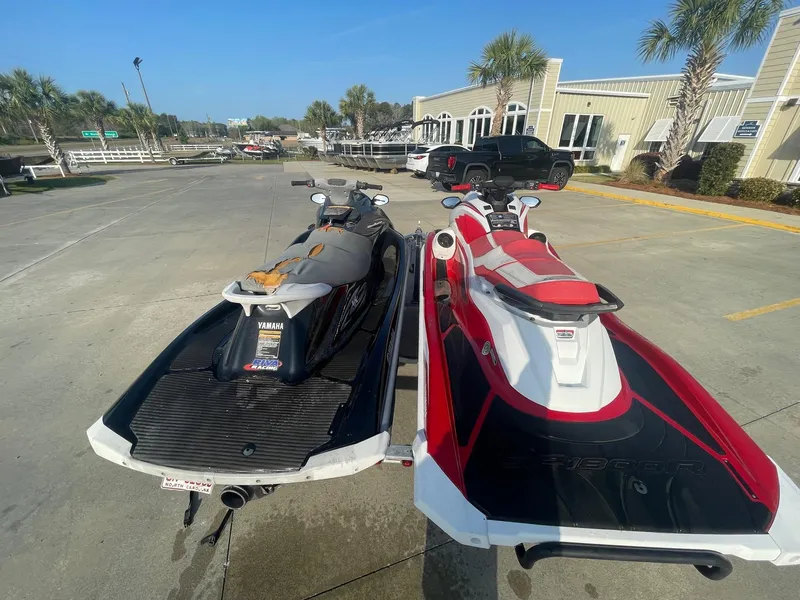 Slide: The Image of Two Yamaha WaveRunner GP1800R HO jet skis parked on a sunny day. - 9