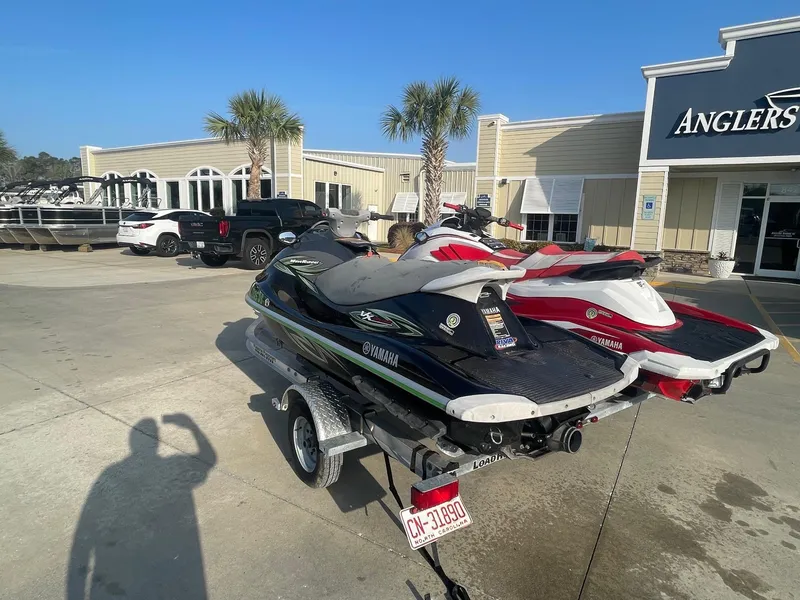 Slide: The Image of 2021 Yamaha WaveRunner GP1800R HO jet skis on trailer outside dealership. - 3