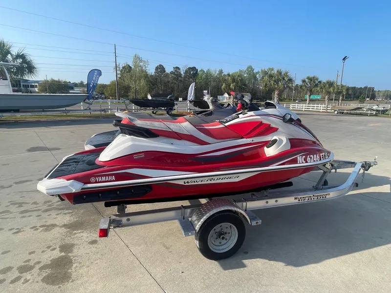 Slide: The Image of 2021 Yamaha WaveRunner GP1800R HO on trailer, red and white, parked outdoors. - 5