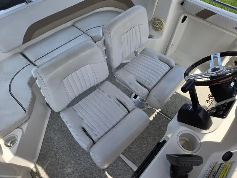 Slide: The Image of 2006 Hurricane GS 211 OB Fun Deck boat interior with dual seats and steering wheel. - 10