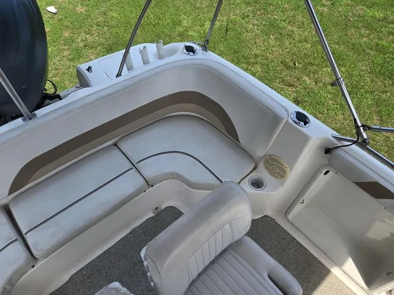 Slide: The Image of 2006 Hurricane GS 211 OB Fun Deck interior with seating and cup holders. - 11