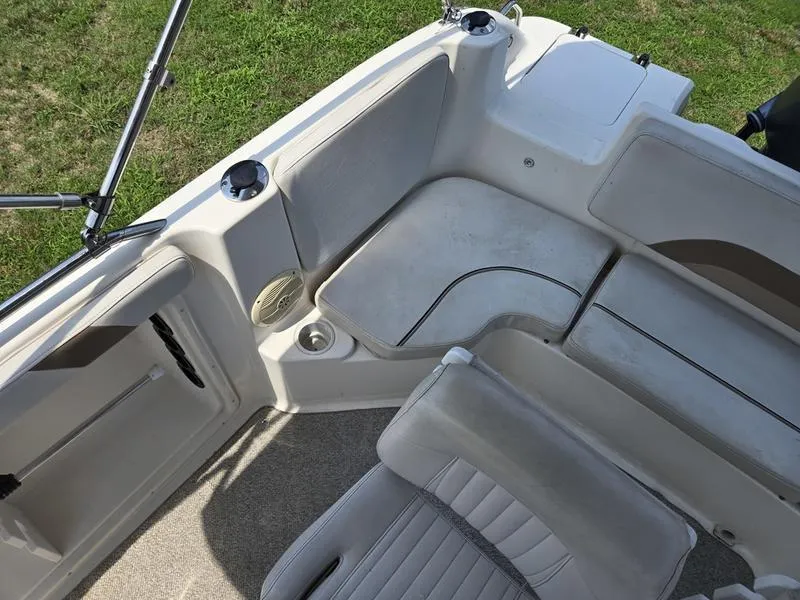 Slide: The Image of 2006 Hurricane GS 211 OB Fun Deck interior with seating and cup holders. - 12