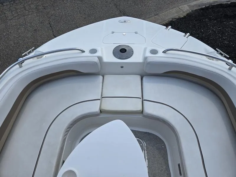 Slide: The Image of 2006 Hurricane GS 211 OB Fun Deck boat interior with cushioned seating. - 15