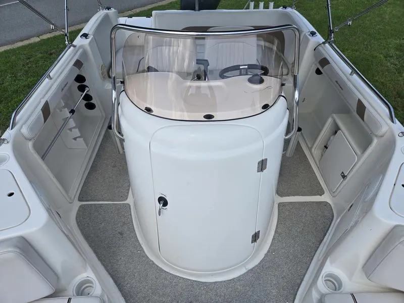 Slide: The Image of 2006 Hurricane GS 211 OB Fun Deck interior with helm and seating area. - 17