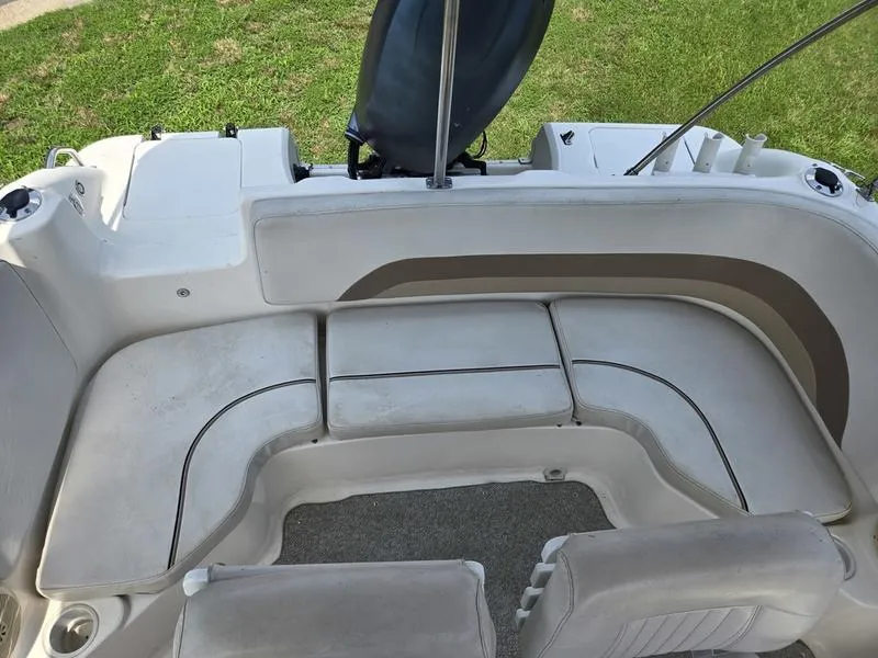 Slide: The Image of 2006 Hurricane GS 211 OB Fun Deck boat interior with cushioned seating. - 6