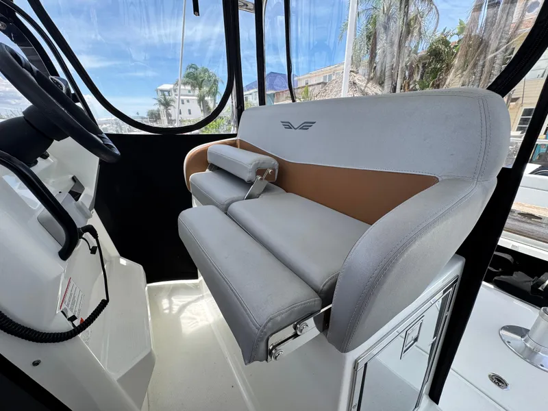 Slide: The Image of 2022 Beneteau Flyer 9 SUNdeck interior with modern seating and steering wheel. - 13