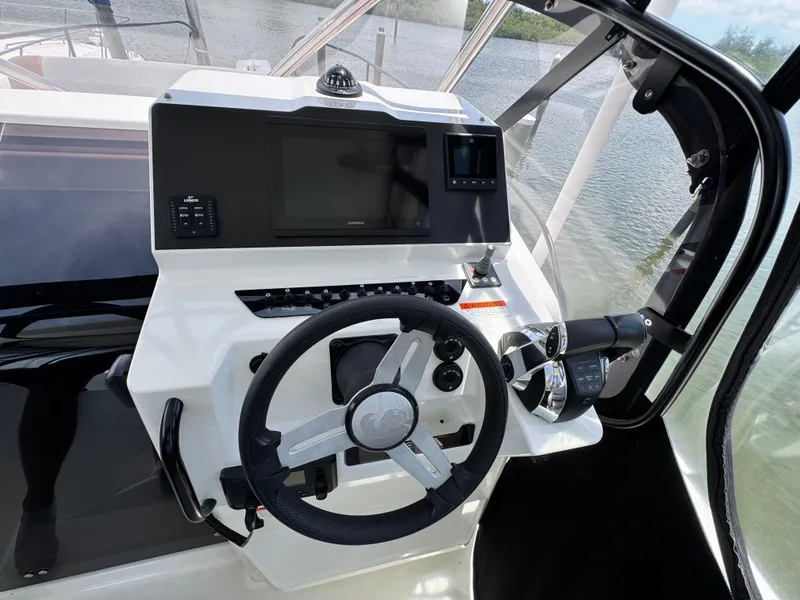 Slide: The Image of Helm of 2022 Beneteau Flyer 9 SUNdeck with steering wheel and navigation controls. - 15