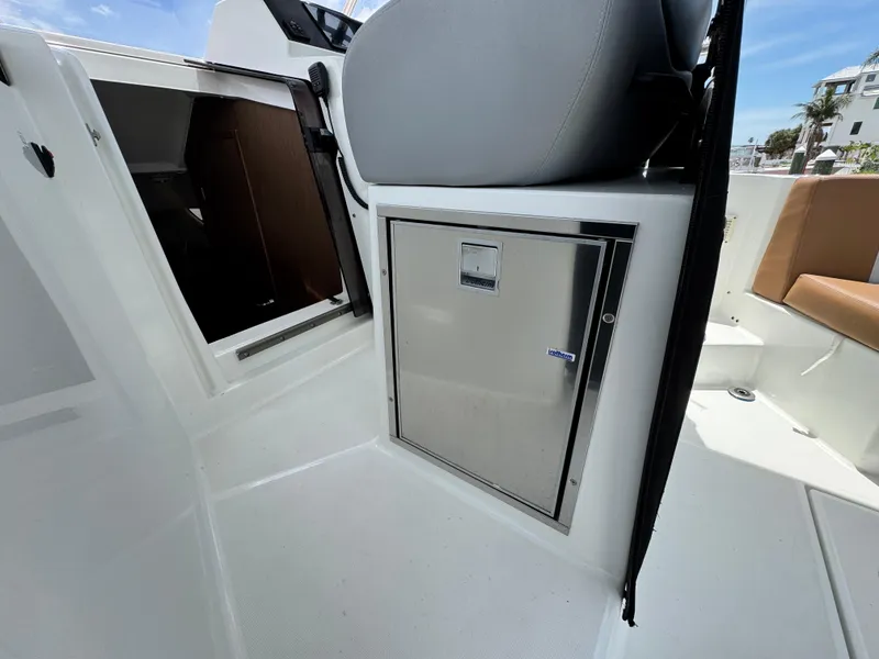 Slide: The Image of 2022 Beneteau Flyer 9 SUNdeck interior with seating and storage compartment. - 16