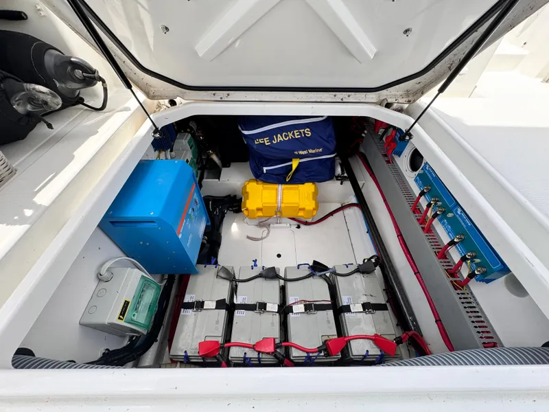 Slide: The Image of 2022 Beneteau Flyer 9 SUNdeck engine compartment with batteries and safety equipment. - 18