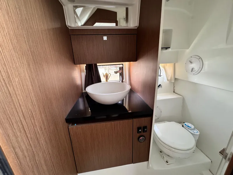 Slide: The Image of 2022 Beneteau Flyer 9 SUNdeck bathroom with modern sink and toilet. - 22