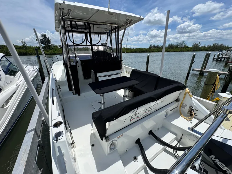 Slide: The Image of 2022 Beneteau Flyer 9 SUNdeck boat docked by a scenic waterfront. - 30