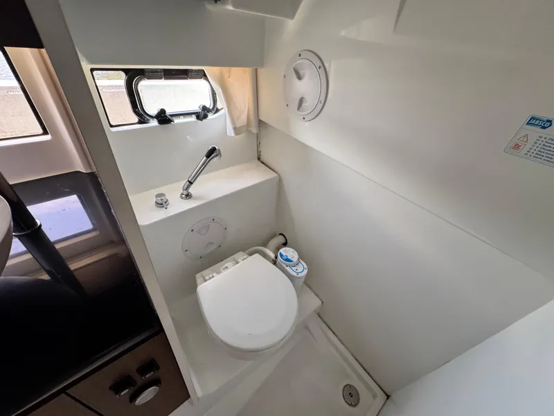 Slide: The Image of 2022 Beneteau Flyer 9 SUNdeck bathroom with compact toilet and window. - 40