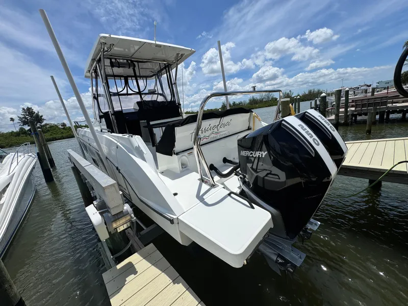 Slide: The Image of 2022 Beneteau Flyer 9 SUNdeck docked, featuring dual Mercury outboard engines. - 5