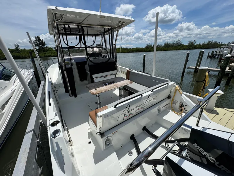 Slide: The Image of 2022 Beneteau Flyer 9 SUNdeck docked, showcasing spacious deck and seating area. - 7