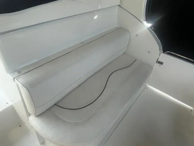 Slide: The Image of White seating area on a 2000 Cruisers Yachts 4450 Express Motoryacht. - 13