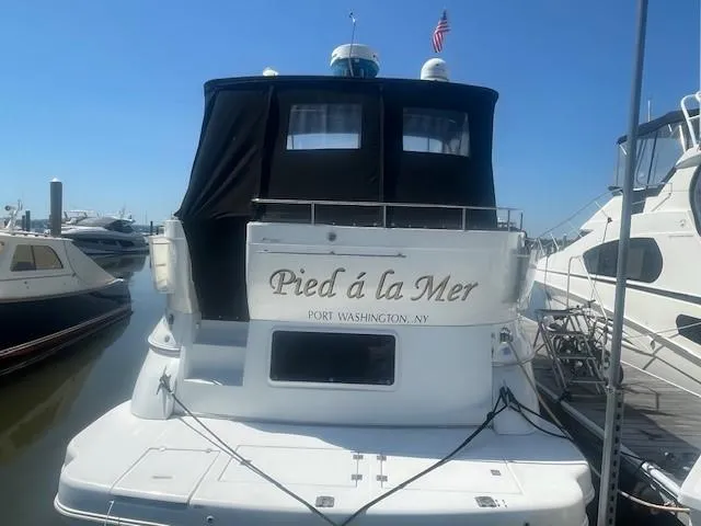 Slide: The Image of 2000 Cruisers Yachts 4450 Express Motoryacht docked, named "Pied á la Mer," Port Washington, NY. - 2