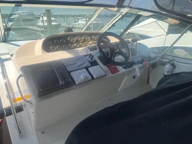 Slide: The Image of Helm of 2000 Cruisers Yachts 4450 Express Motoryacht with navigation instruments and steering wheel. - 20