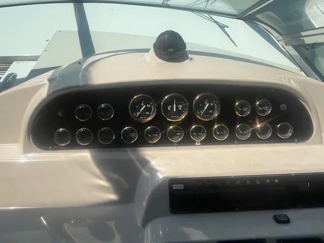 Slide: The Image of Dashboard of 2000 Cruisers Yachts 4450 Express Motoryacht with gauges and controls. - 21