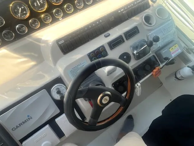 Slide: The Image of Helm of 2000 Cruisers Yachts 4450 Express Motoryacht with Garmin navigation system. - 22