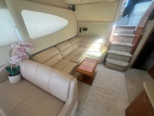 Slide: The Image of Luxurious interior of 2000 Cruisers Yachts 4450 Express Motoryacht with beige leather seating. - 32