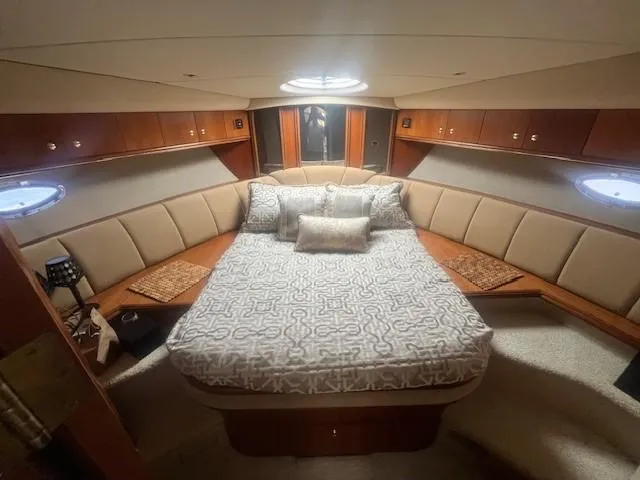 Slide: The Image of Luxurious cabin interior of 2000 Cruisers Yachts 4450 Express Motoryacht with elegant bedding. - 36