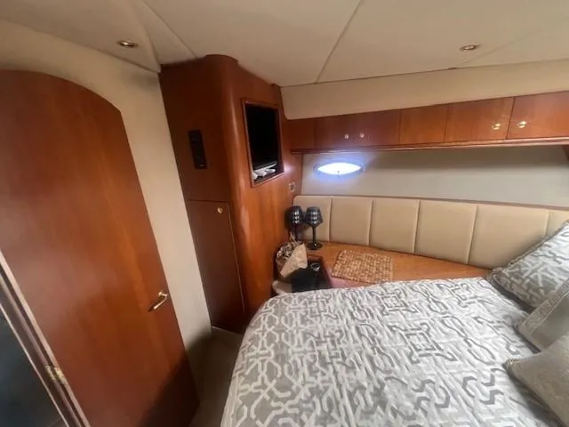 Slide: The Image of Luxurious cabin interior of 2000 Cruisers Yachts 4450 Express Motoryacht with elegant bedding. - 38