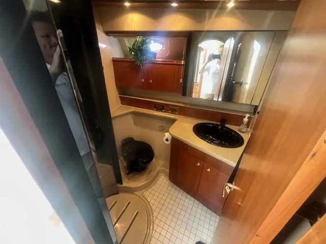 Slide: The Image of Luxurious bathroom in 2000 Cruisers Yachts 4450 Express Motoryacht with modern amenities. - 42