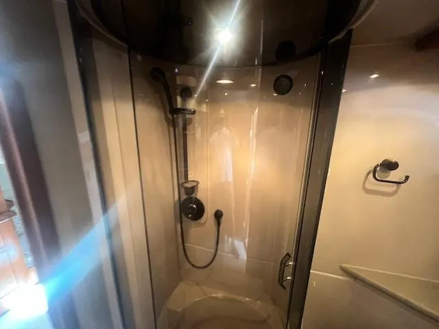 Slide: The Image of Shower area in 2000 Cruisers Yachts 4450 Express Motoryacht, featuring modern fixtures. - 43