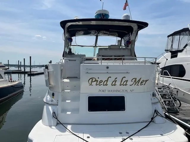 Slide: The Image of 2000 Cruisers Yachts 4450 Express Motoryacht docked, named "Pied à la Mer," Port Washington, NY. - 5