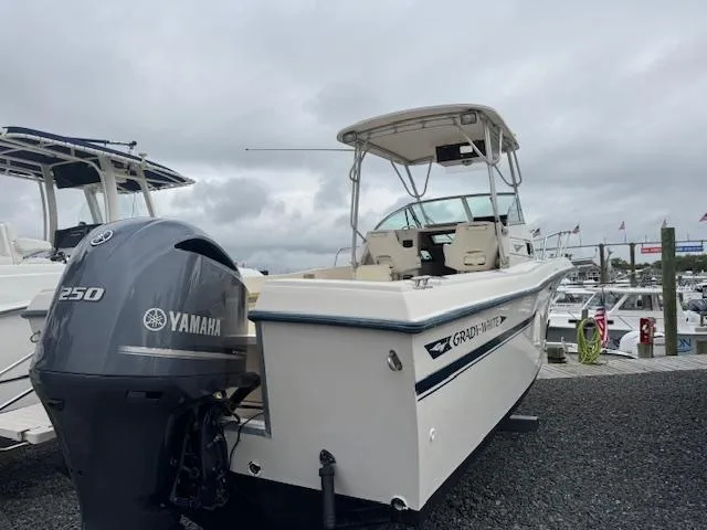 Slide: The Image of 1992 Grady-White Explorer 244 boat with Yamaha 250 engine at marina. - 25
