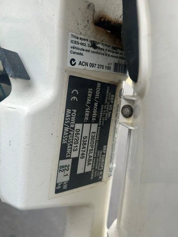 Slide: The Image of Close-up of a 1983 Boston Whaler Sport engine label with serial and model details. - 17