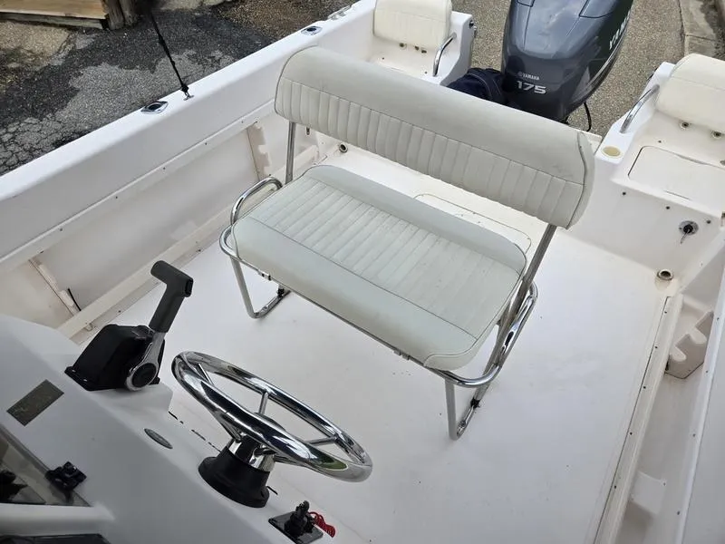 Slide: The Image of 2002 Grady-White 209 ESCAPE boat interior with steering wheel and seating. - 10